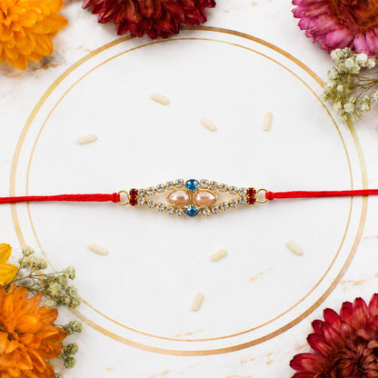 Royal Pearl & AD Stone Rakhi with Blue & Red Stones for Brother