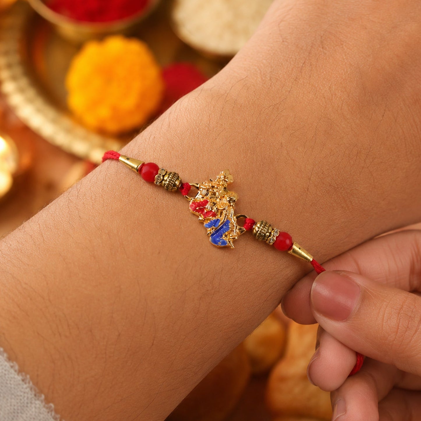 Golden Peacock (Mor) Rakhi with Blue Enamel & Red Beads
