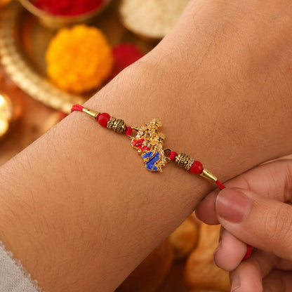 Golden Peacock (Mor) Rakhi with Blue Enamel & Red Beads