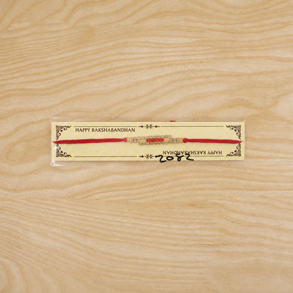 Slim American Diamond Studded Bar Rakhi on Red Thread