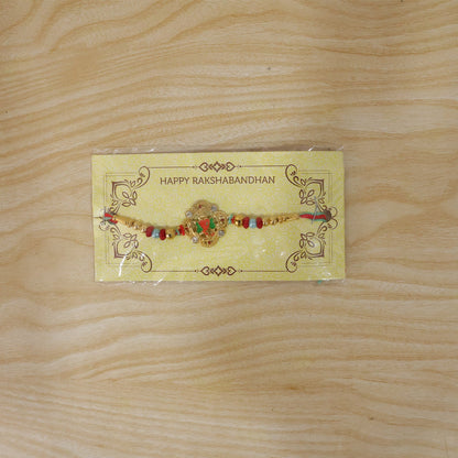Colourful Floral Kundan Rakhi with Green Peacock Accent