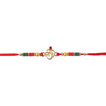 Golden Om (?) Rakhi with Red & Green Crystal Beads