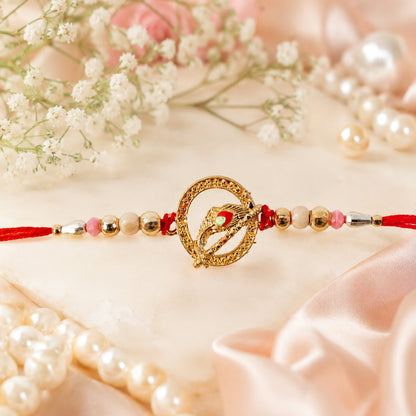 Golden Peacock Spiral Rakhi with Beads