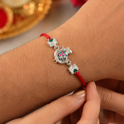 Silver Peacock Meenakari Rakhi with Green & Pink Enamel