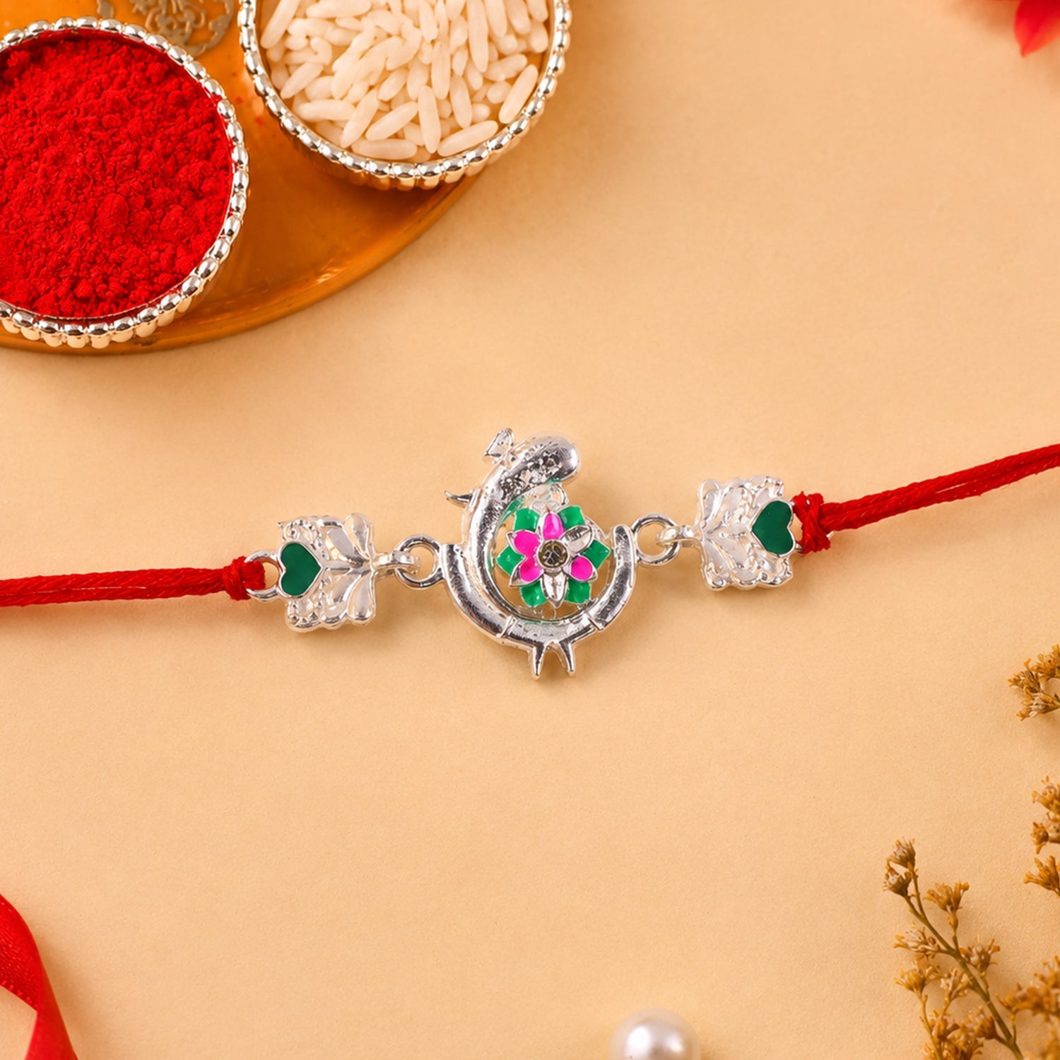 Silver Peacock Meenakari Rakhi with Green & Pink Enamel