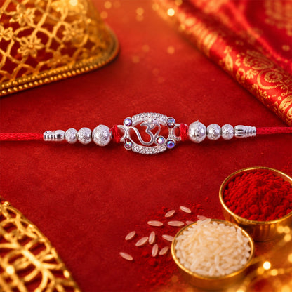 Oxidised Silver Om (?) Rakhi with Crystal Beads