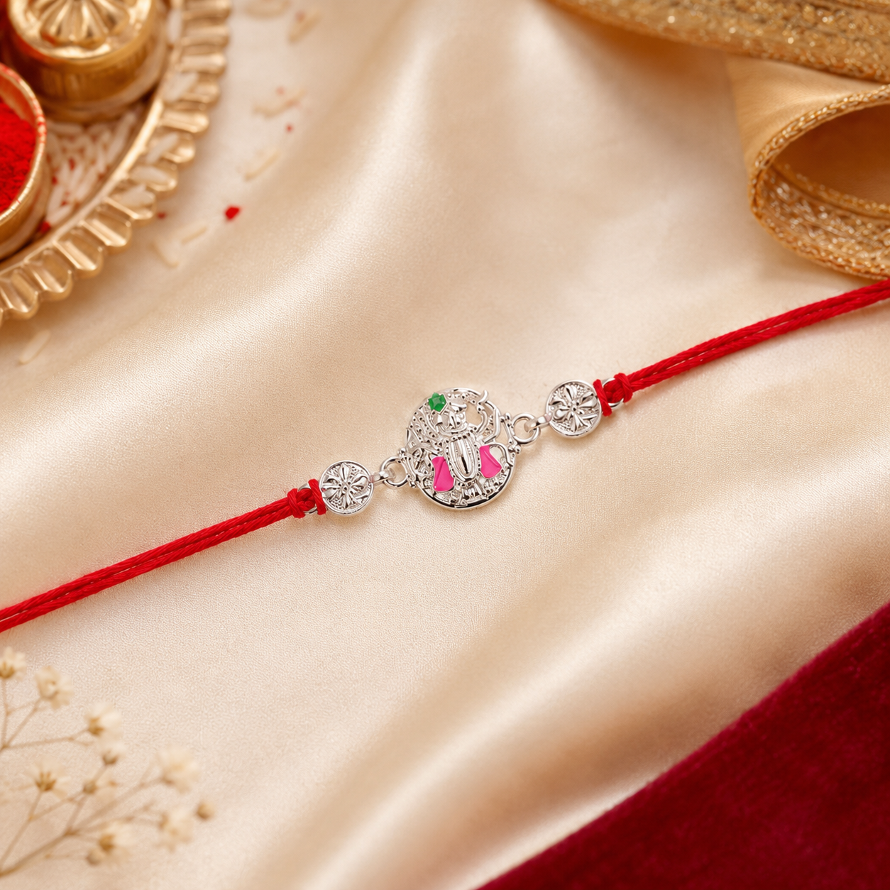 Silver Floral Meenakari Rakhi on Red Thread