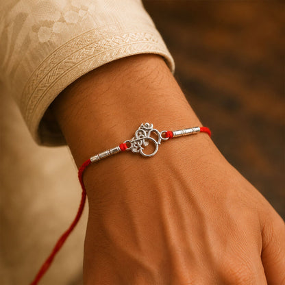 Silver Om (?) Rakhi with Textured Beads