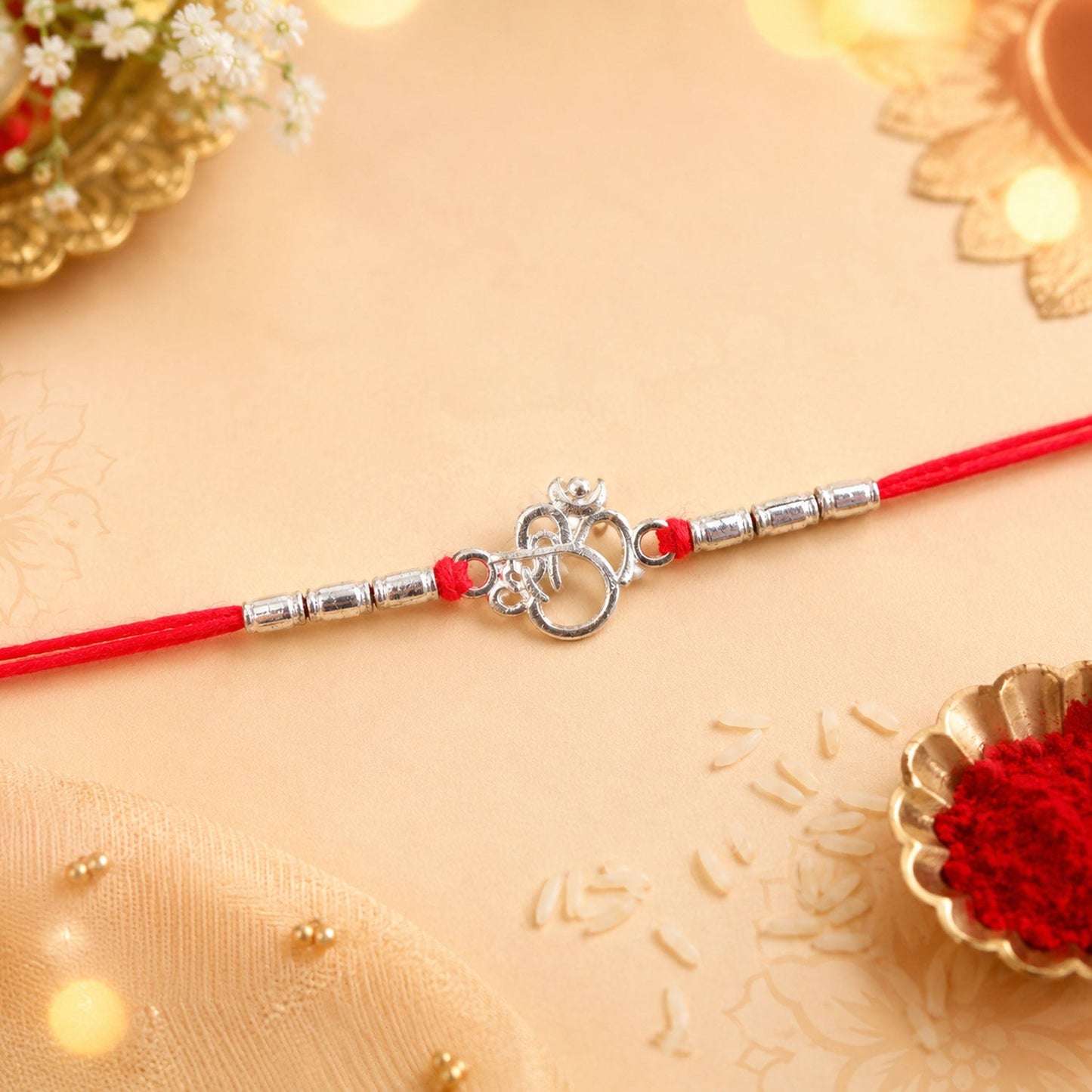 Silver Om (?) Rakhi with Textured Beads