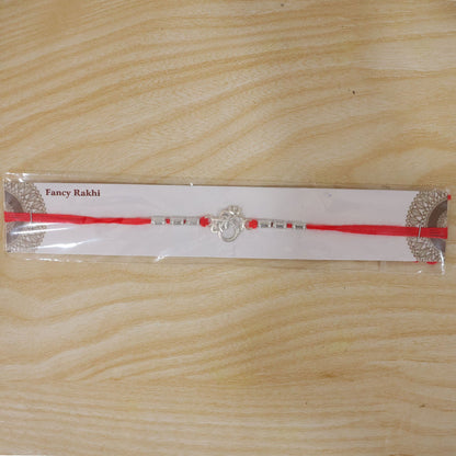 Silver Om (?) Rakhi with Textured Beads
