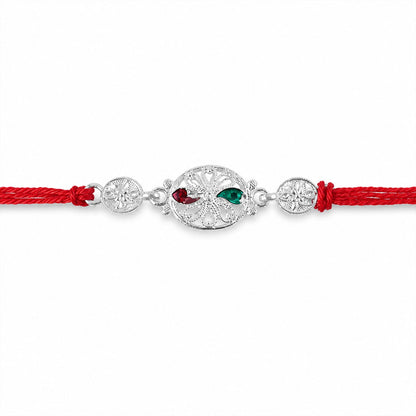 Silver Filigree Rakhi with Red & Green Teardrop Stones