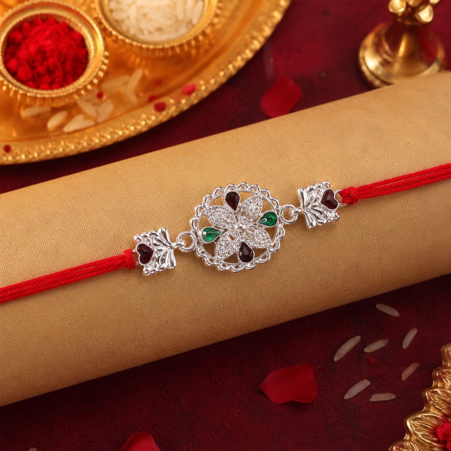 Silver Floral Rakhi with Red & Green Teardrop Stones