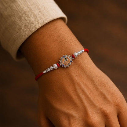 Silver Swastik Rakhi with Red Stones & Beads