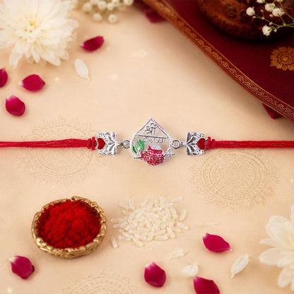 Silver Peacock Meenakari Rakhi with Red & Green Accents