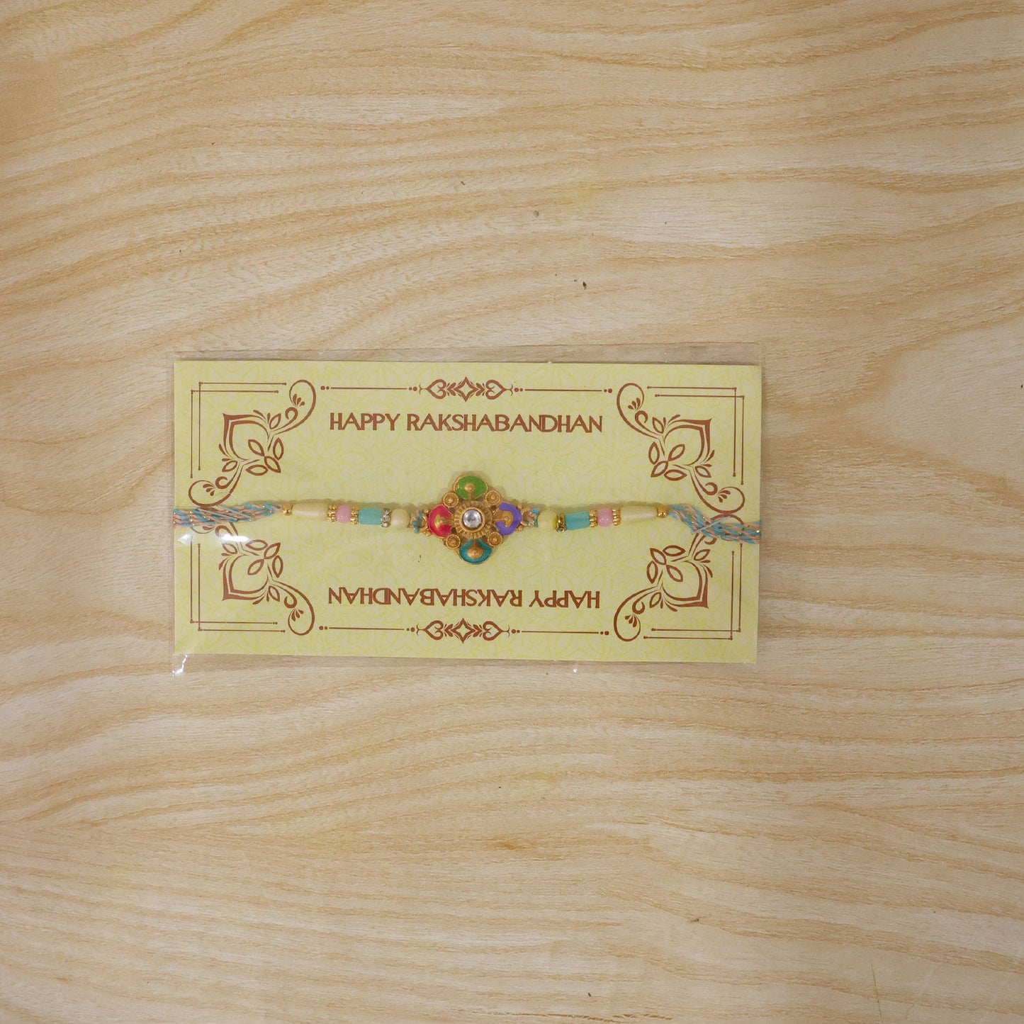 Colourful Meenakari Floral Rakhi with Pastel Beads for Brother