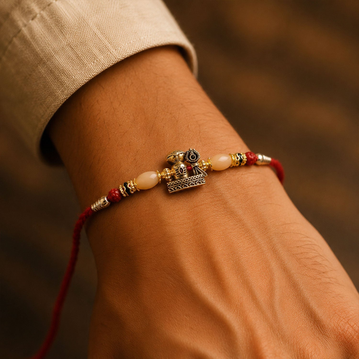 Antique Golden Shivling Rakhi with Beads for Brother