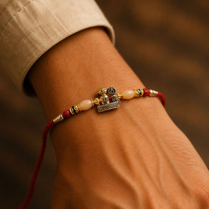 Antique Golden Shivling Rakhi with Beads for Brother