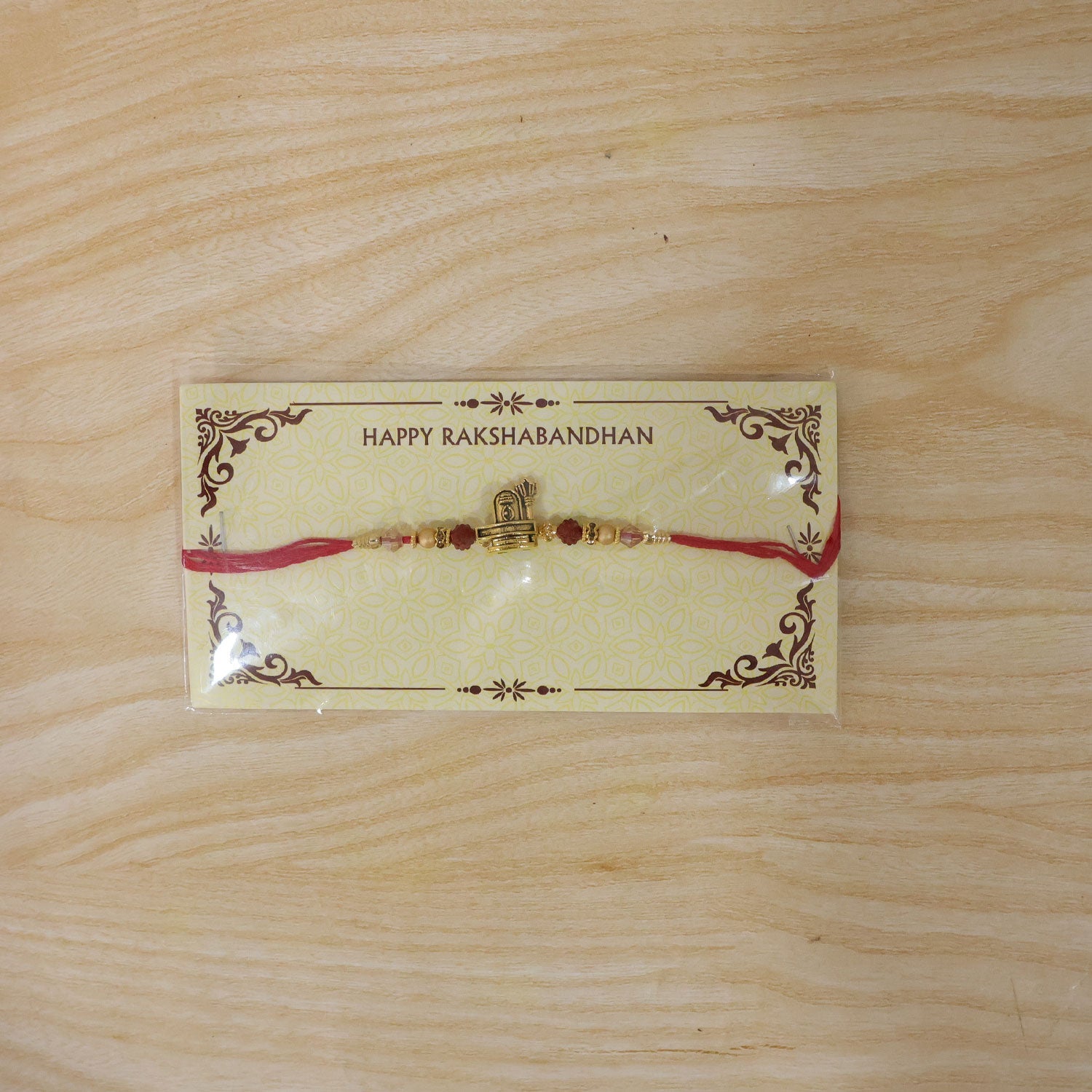 Antique Gold Shivling Trishul Rakhi with Rudraksha for Brother