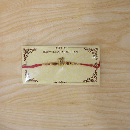 Antique Gold Shivling Trishul Rakhi with Rudraksha for Brother