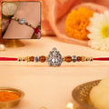 Silver Ganesha Rakhi – Rudraksha Wooden Beads for Raksha Bandhan