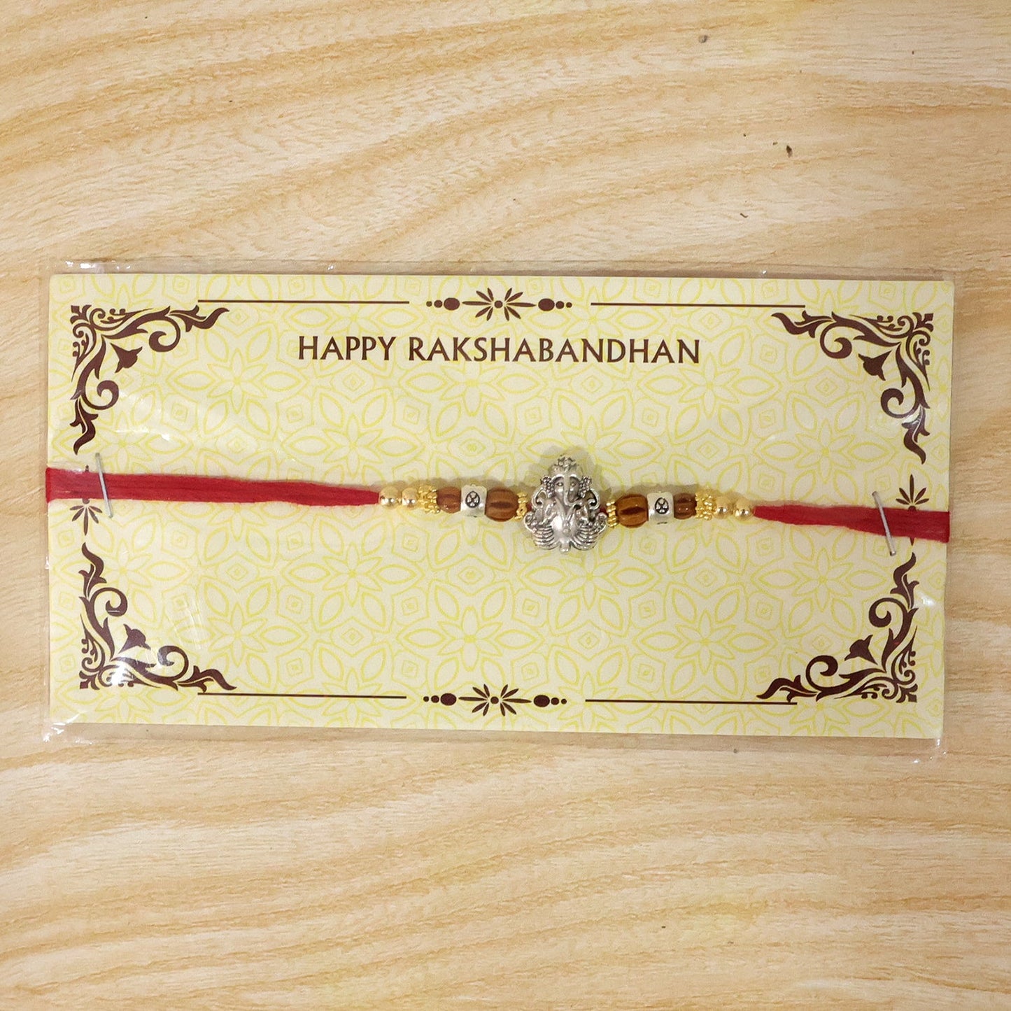 Silver Lord Ganesha Rakhi with Rudraksha & Wooden Beads for Bro