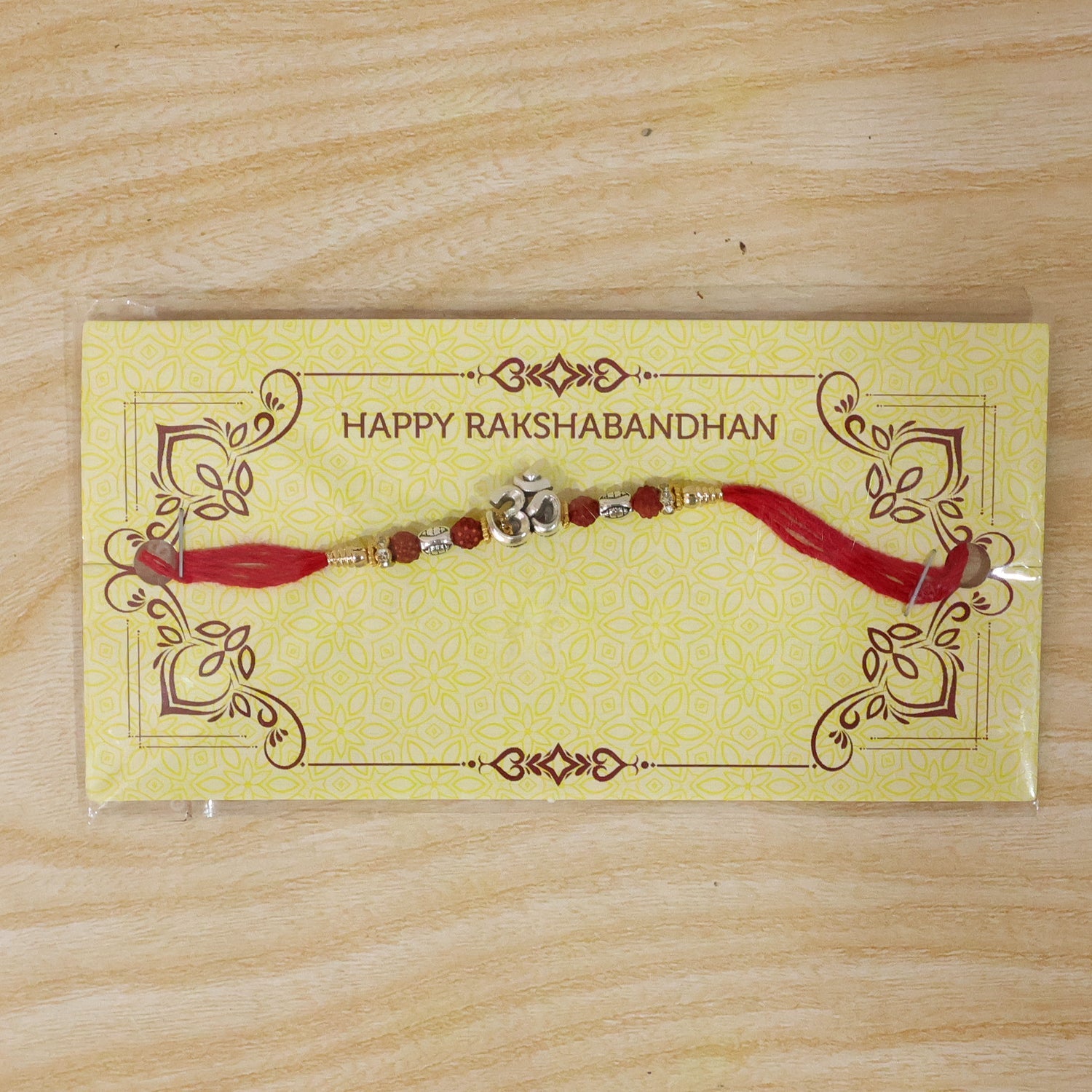 Sacred Silver Om Rakhi with Rudraksha Beads for Brother