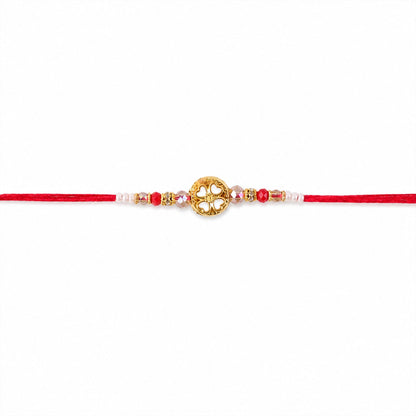 Golden Floral Cutwork Rakhi with Red Crystal Beads for Brother
