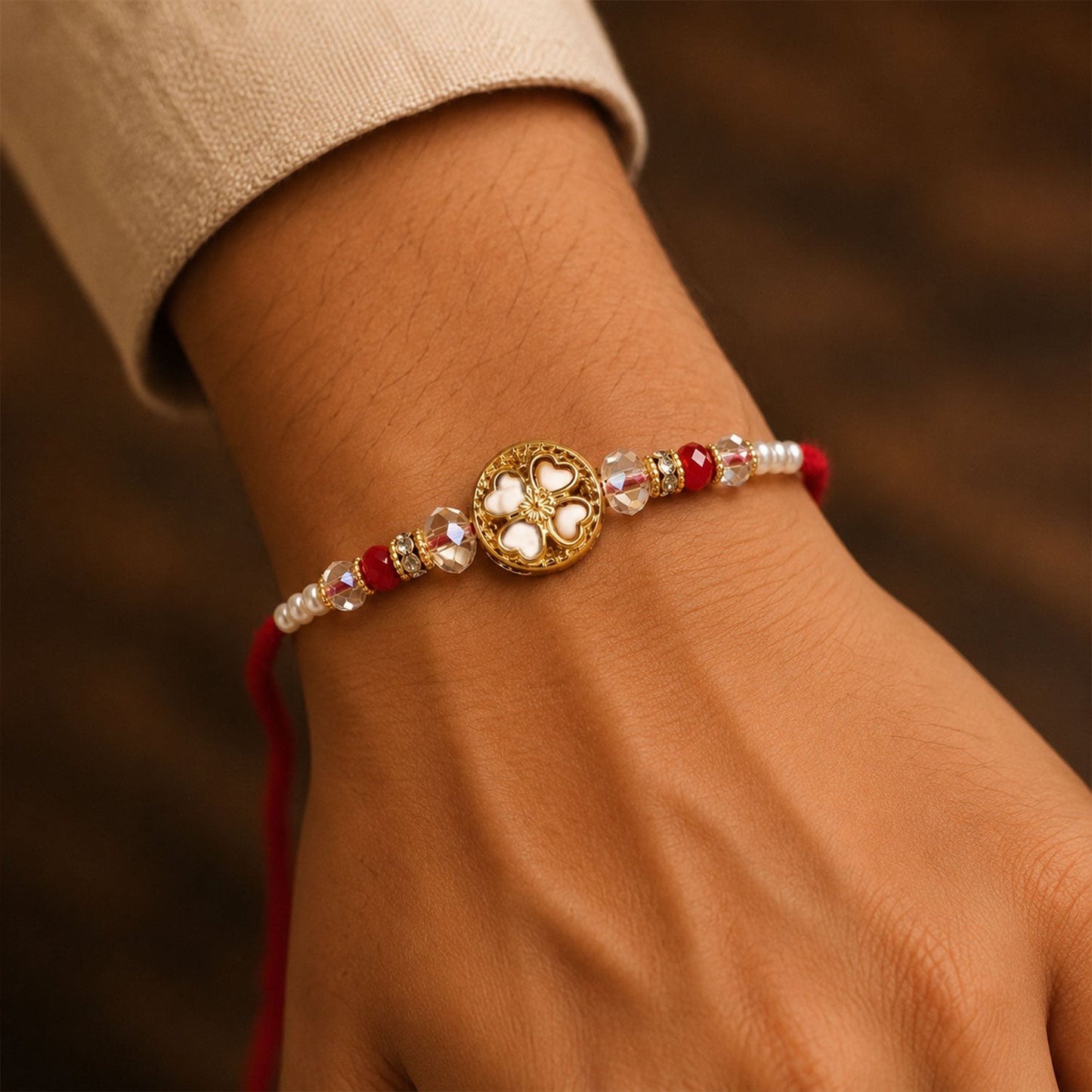 Golden Floral Cutwork Rakhi with Red Crystal Beads for Brother