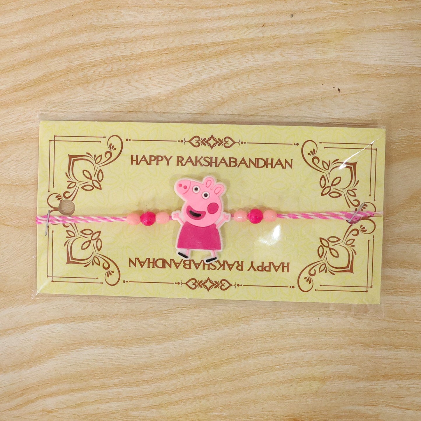 Cartoon Character Rakhi with Pink Beads for Kids