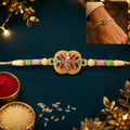Golden Meenakari Floral Rakhi – Elegant Design for Brotherhood