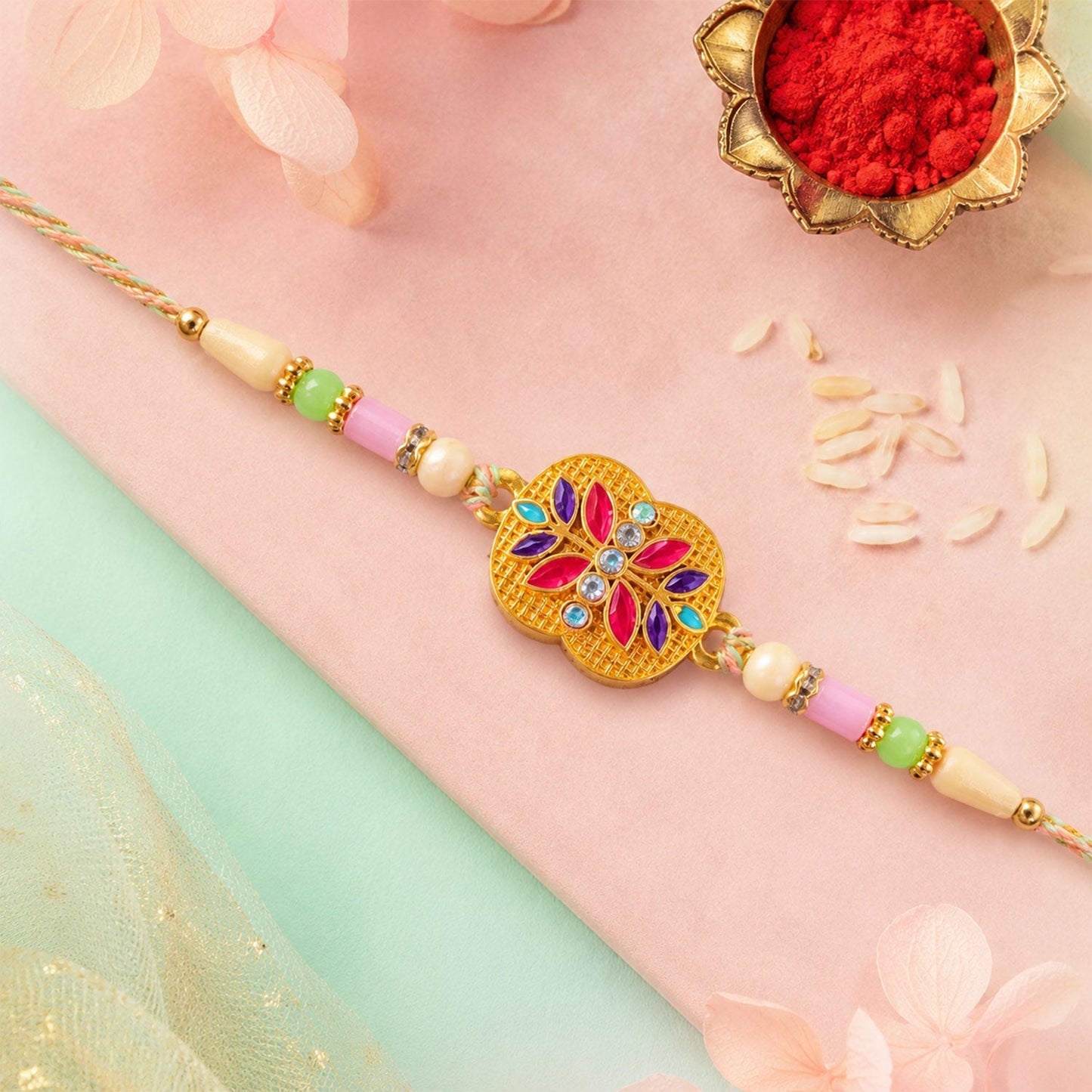 Golden Meenakari Floral Rakhi with AD Stones & Pearls for Brother