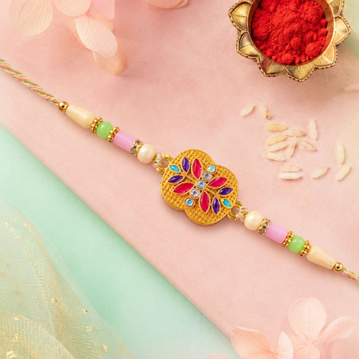 Golden Meenakari Floral Rakhi with AD Stones & Pearls for Brother