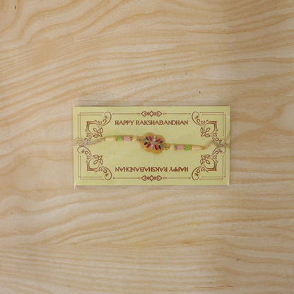 Golden Meenakari Floral Rakhi with AD Stones & Pearls for Brother