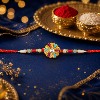 Golden Meenakari Pinwheel Rakhi with Enamel & Diamond Stone