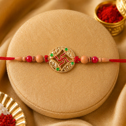 Auspicious Golden Swastik Rakhi with Wooden & Red Beads for Brother