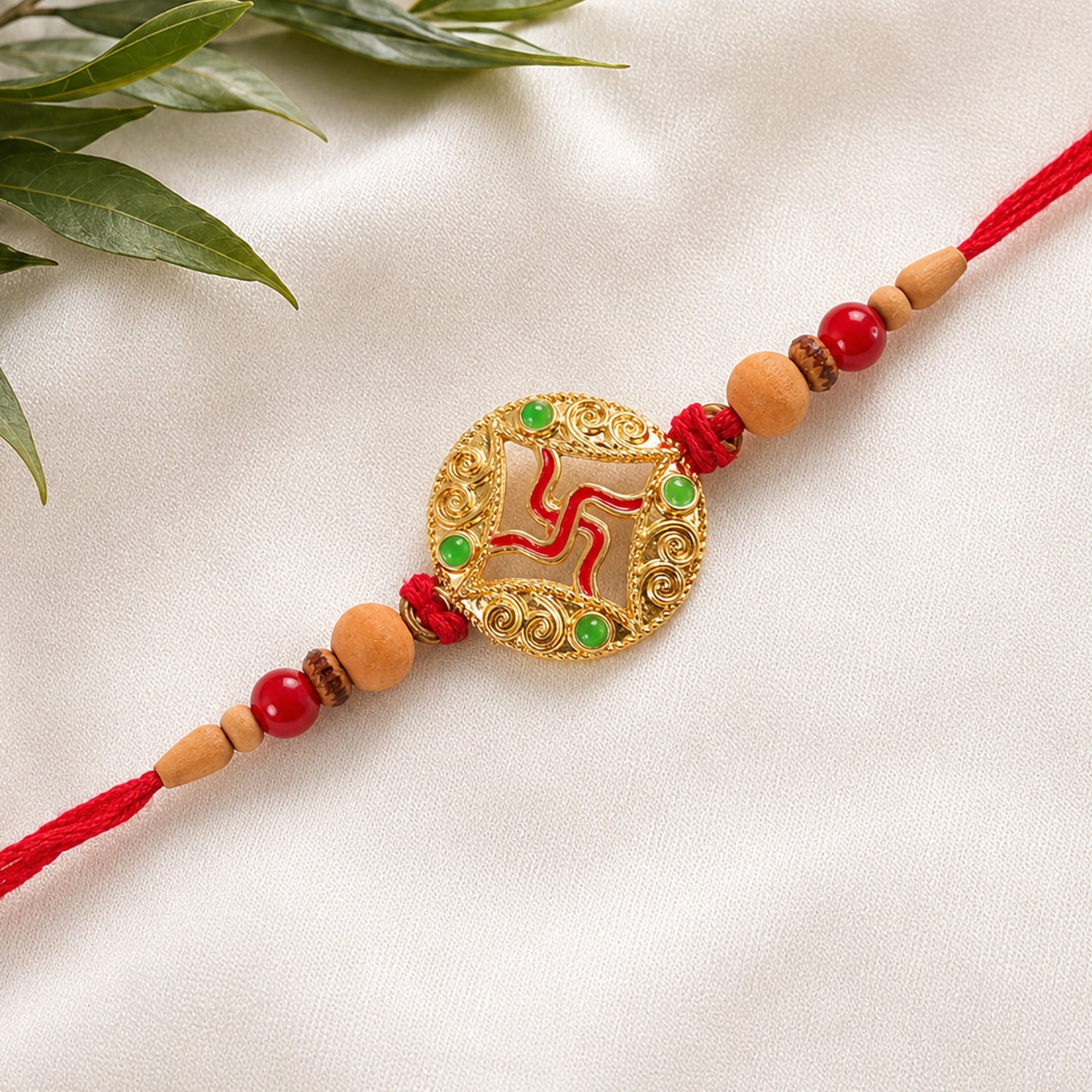Auspicious Golden Swastik Rakhi with Wooden & Red Beads for Brother