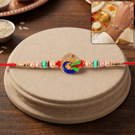 Golden Meenakari Peacock Rakhi with Pearl & Turquoise Beads for Bro