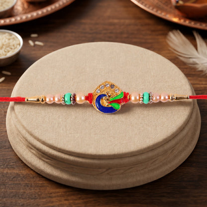 Golden Meenakari Peacock Rakhi with Pearl & Turquoise Beads for Bro