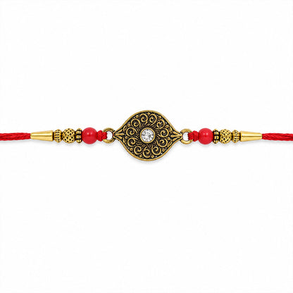Antique Oval Rakhi with Red Crystal Beads for Brother