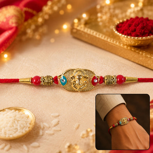 Golden Lord Ganesha Oval Rakhi with Red & Blue Beads for Brother