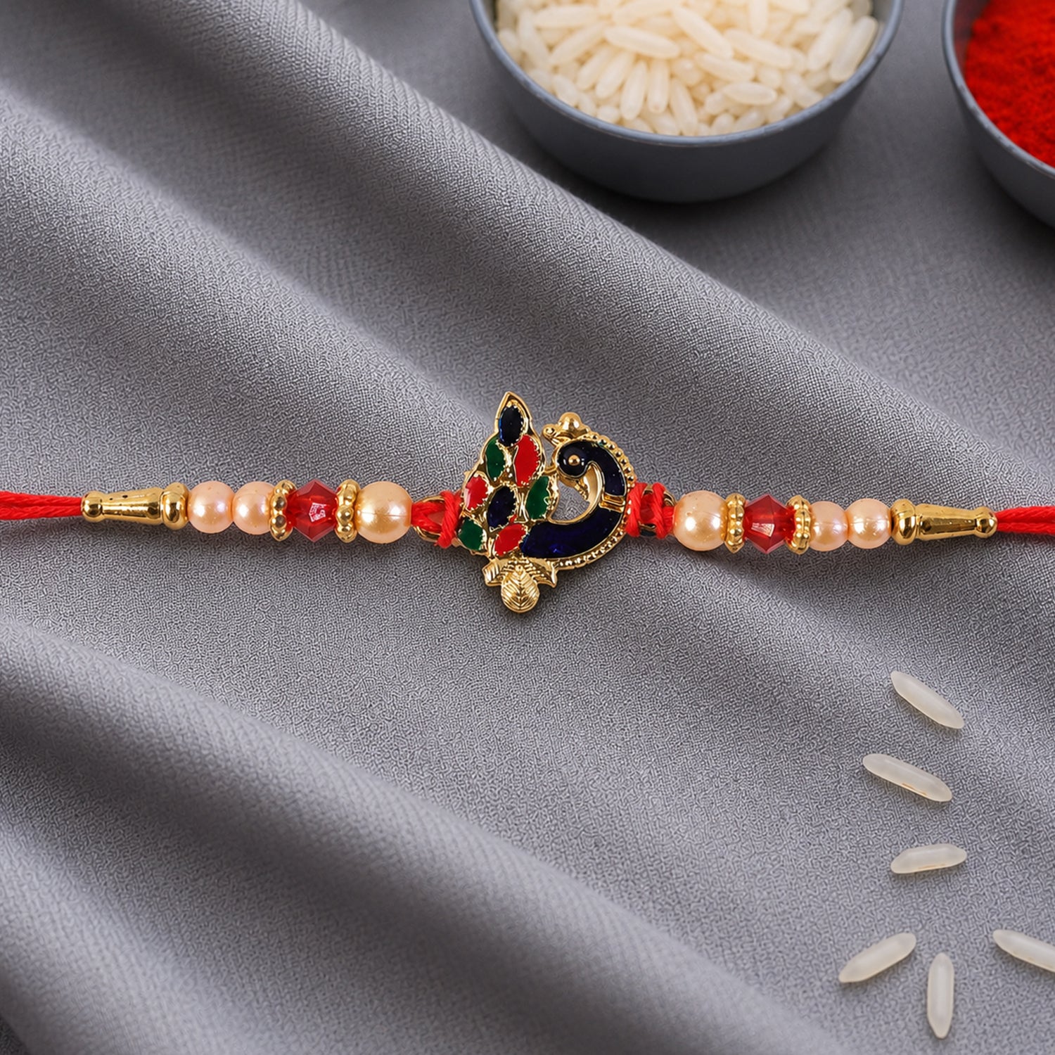 Blue Meenakari Peacock Rakhi with Pearl & Crystal Beads for Brother