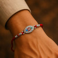 Rakhi – Elegant Silver Beads with Traditional Charm