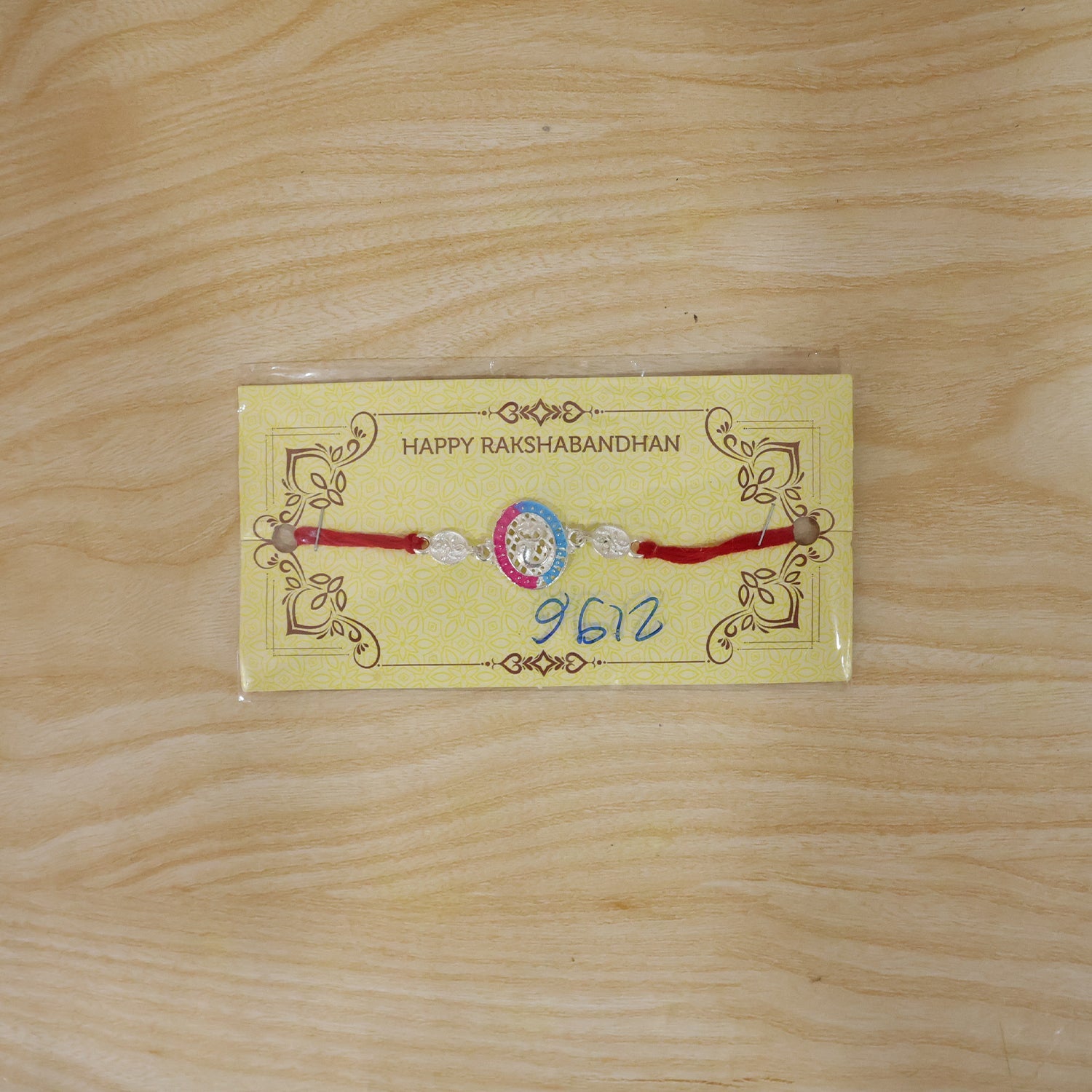 Silver Meenakari Rakhi with Pink & Blue Enamel for Brother