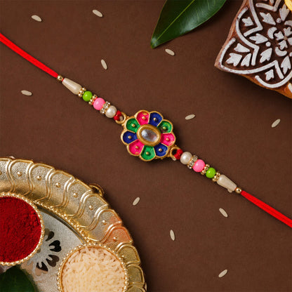 Detailed design of multicolor rakhi with pearl beads