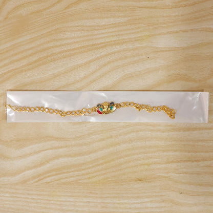 Festive rakhi showcasing Peacock Ganesh charm and thread