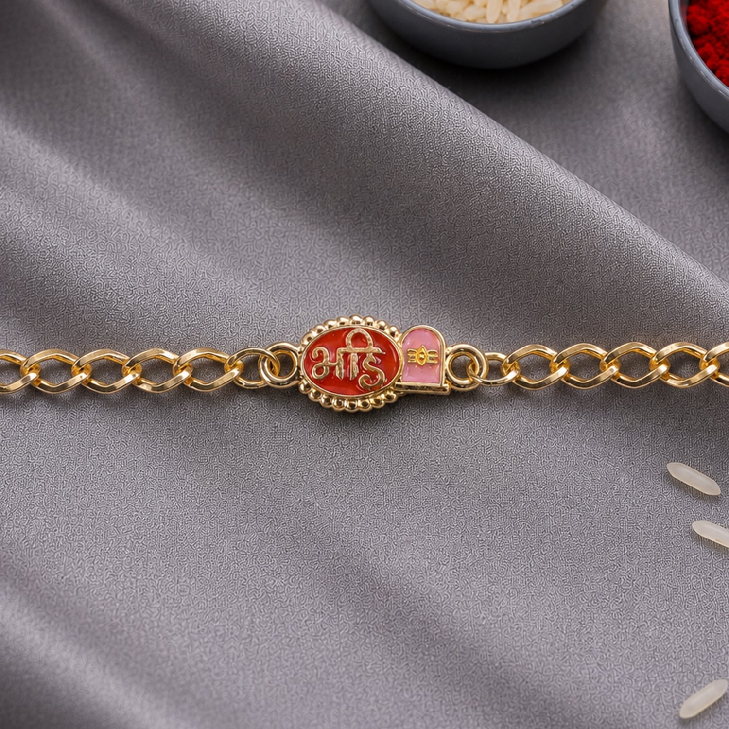 Side view of Bhai Red Enamel Gold Tone Rakhi bracelet