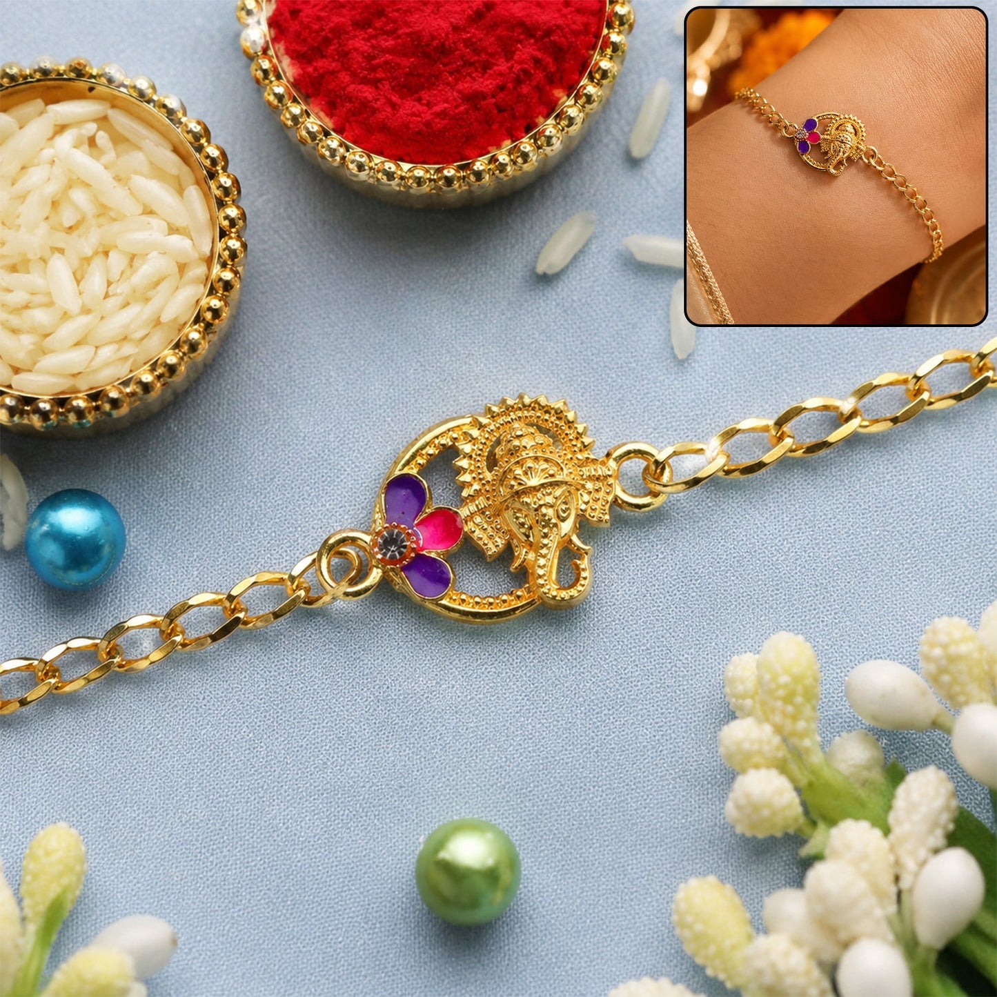 Lord Ganesha stone gold tone rakhi bracelet close-up