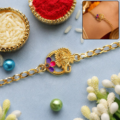 Lord Ganesha stone gold tone rakhi bracelet close-up