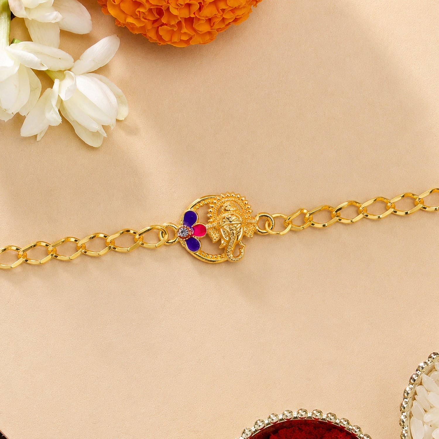 Decorative beads and thread detail of Lord Ganesha rakhi