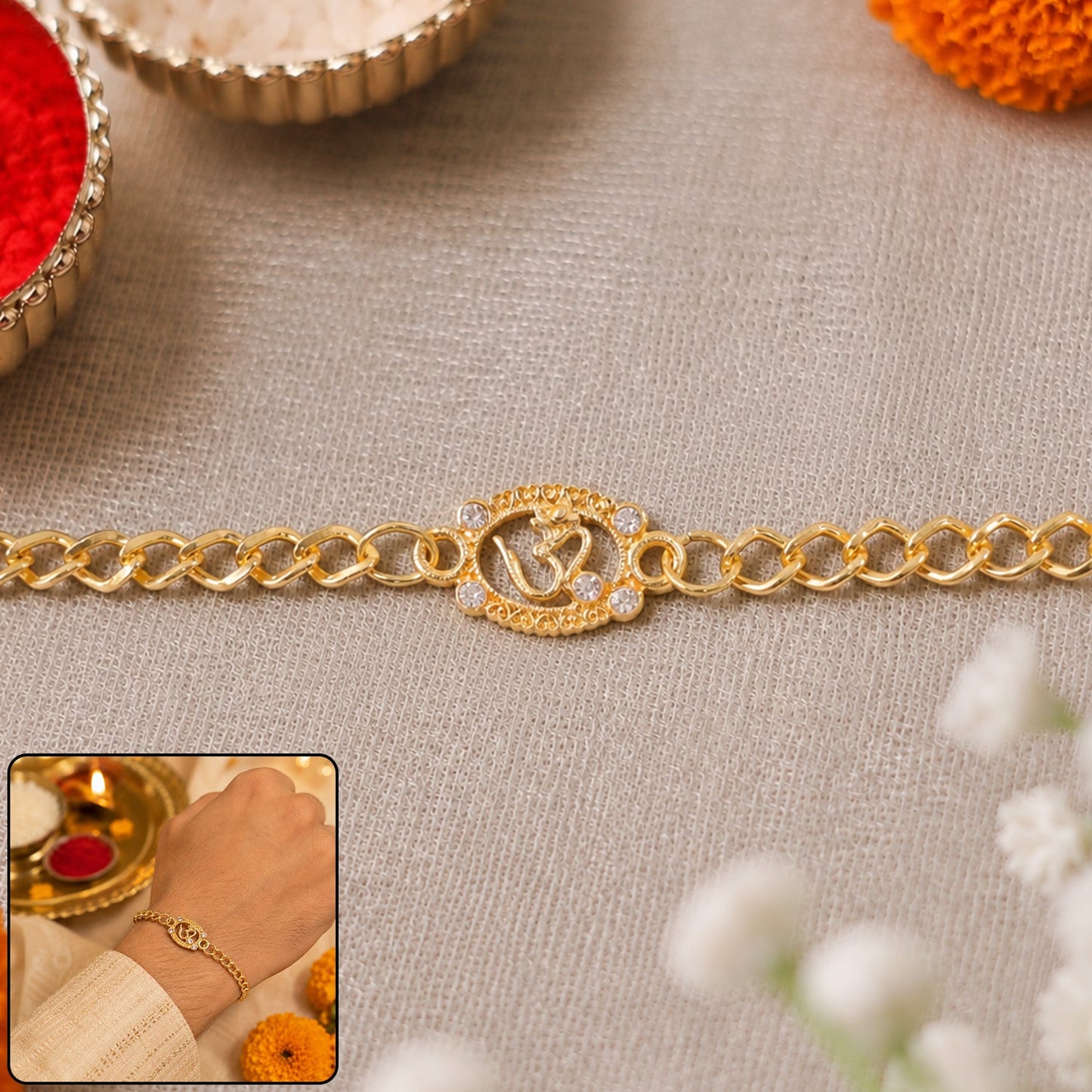Om stone studded gold tone rakhi bracelet close-up